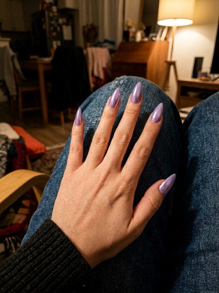 Lilac chrome nails painted onto a real hand photo